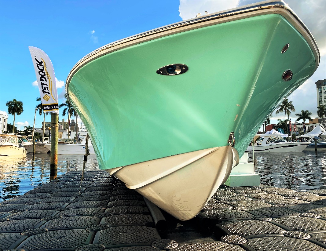 Close up of a teal boat on a Jet Dock