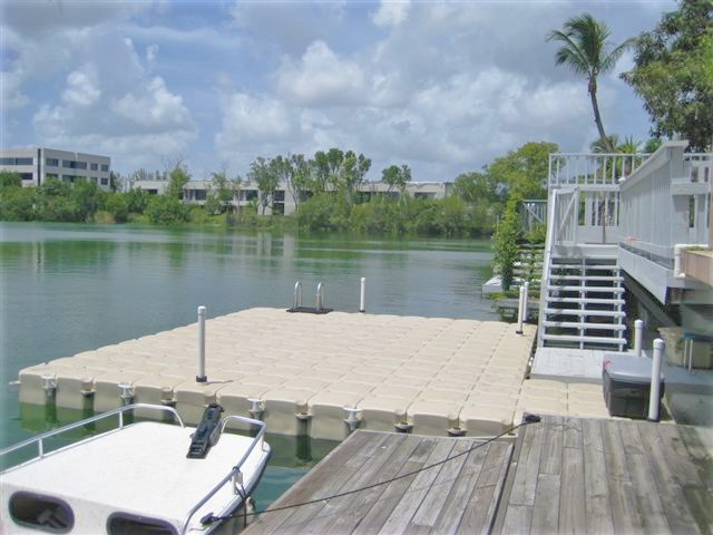 Large Tan Platform Dock with a ladder for Swimming