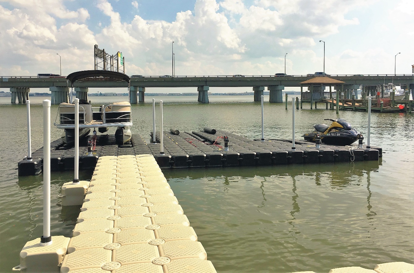 Two-Tone Floating Boat Dock with Tan Walkway and Black Dock