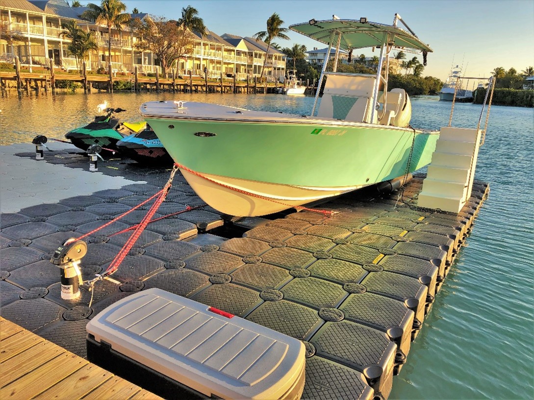 Black Drive on Jet Dock with Green Boat Docked