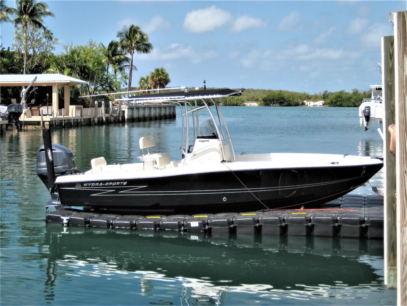 Black Jet Dock with Boat Docked in Saltwater