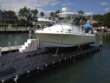 Large boat lift with boat anchored to it